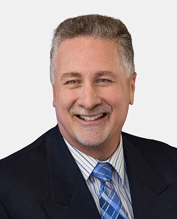 Headshot of John Assily